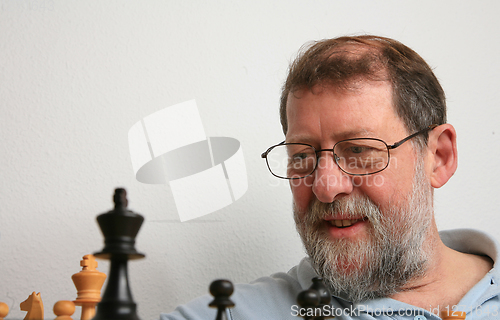 Image of Mature scandinavian man playing chess