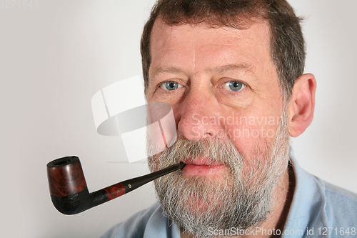 Image of Mature scandinavian man smoking  pipe