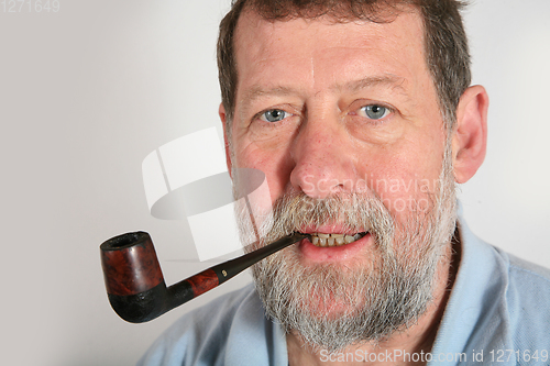 Image of Mature scandinavian man smoking  pipe