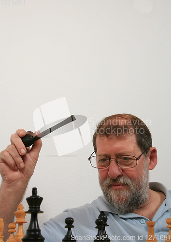 Image of Mature scandinavian man playing chess