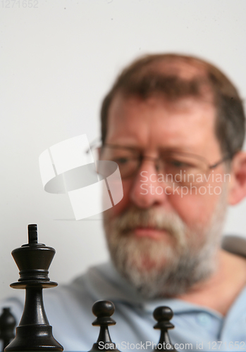 Image of Mature scandinavian man playing chess