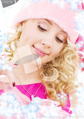 Image of cheerful santa helper girl with gift box