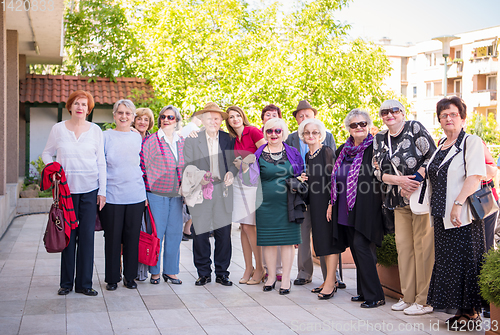 Image of group portrait of senior people with geriatric nurse