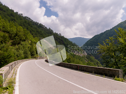 Image of asphalt road in beautiful countryside