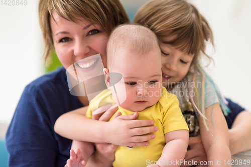 Image of portrait of young mother with  her kids