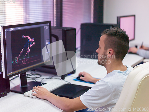 Image of Graphic Designer Working at Workplace