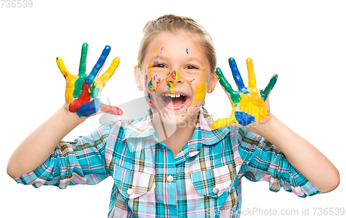 Image of Portrait of a cute girl playing with paints