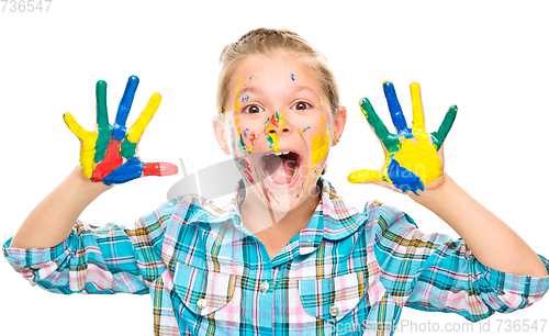 Image of Portrait of a cute girl playing with paints