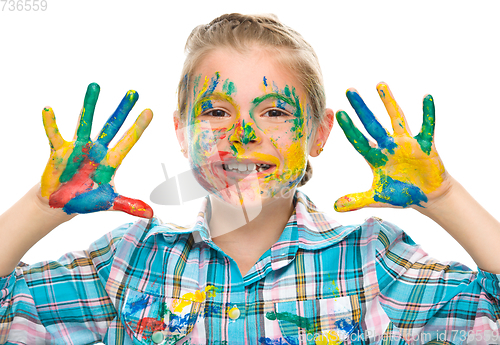 Image of Portrait of a cute girl playing with paints
