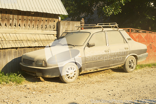 Image of Car covered dust street Romania