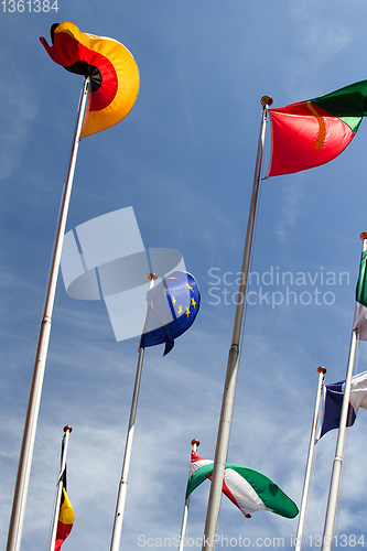 Image of Many europeans flags in the wind against the sky