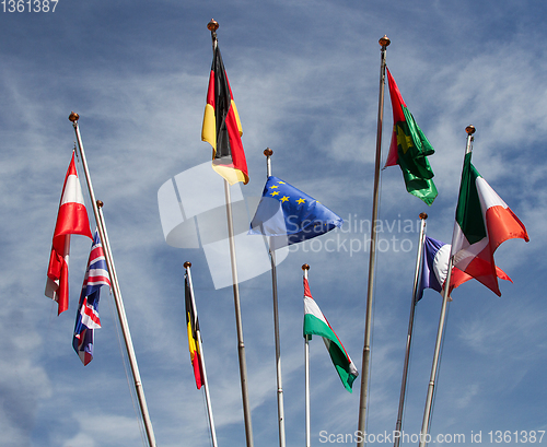 Image of Many europeans flags in the wind against the sky