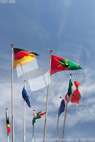 Image of Many europeans flags in the wind against the sky