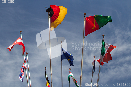 Image of Many europeans flags in the wind against the sky