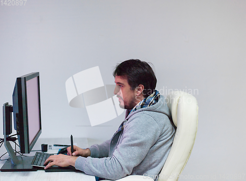 Image of Graphic Designer Working at Workplace