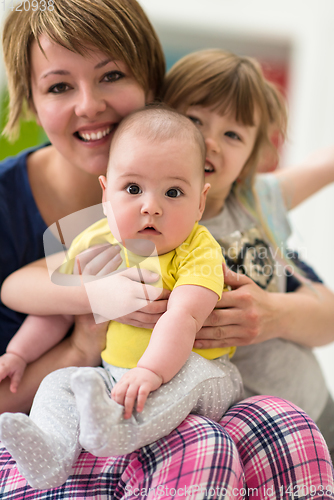 Image of portrait of young mother with  her kids