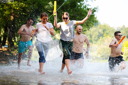 Image of summer joy friends having fun on river