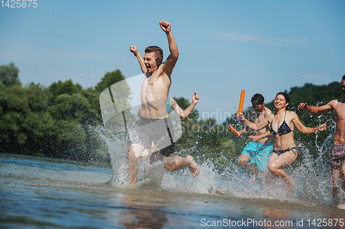 Image of summer joy friends having fun on river