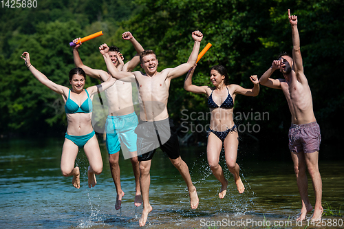 Image of summer joy friends having fun on river