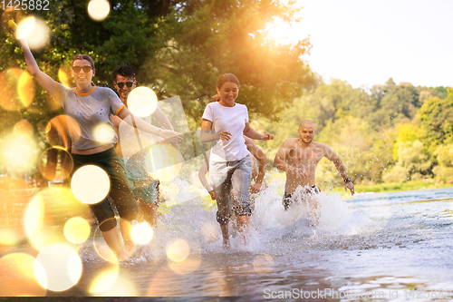 Image of summer joy friends having fun on river