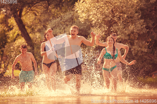 Image of summer joy friends having fun on river
