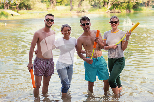 Image of summer joy friends having fun on river