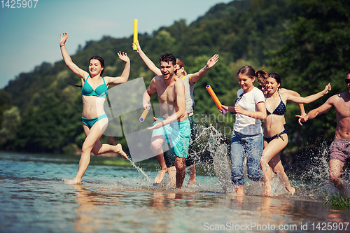 Image of summer joy friends having fun on river