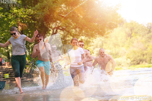 Image of summer joy friends having fun on river