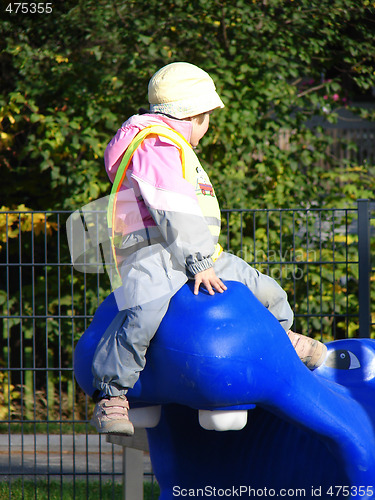 Image of Child plays on playground