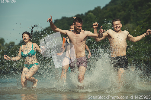 Image of summer joy friends having fun on river