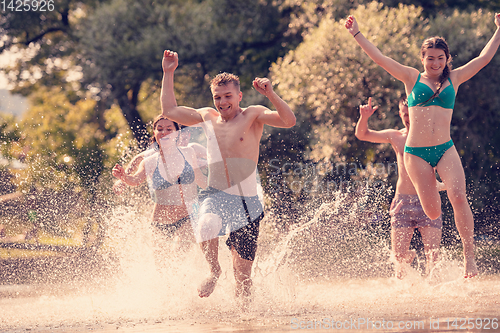 Image of summer joy friends having fun on river