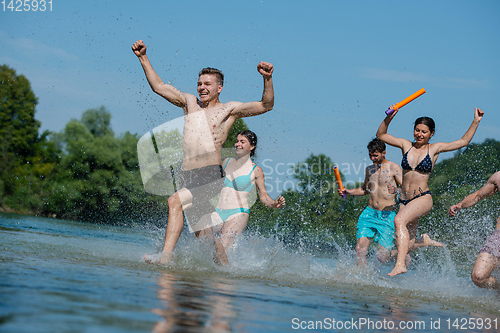 Image of summer joy friends having fun on river