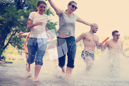 Image of summer joy friends having fun on river
