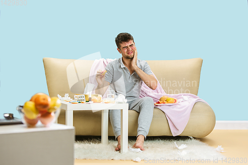 Image of Young man suffering from allergy to citrus fruits