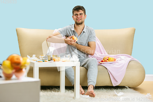 Image of Young man suffering from allergy to citrus fruits