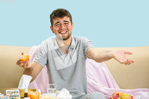 Image of Young man suffering from allergy to citrus fruits