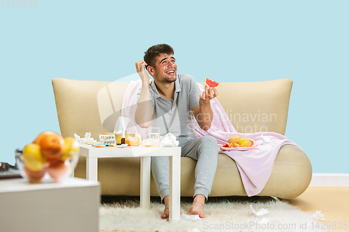 Image of Young man suffering from allergy to citrus fruits