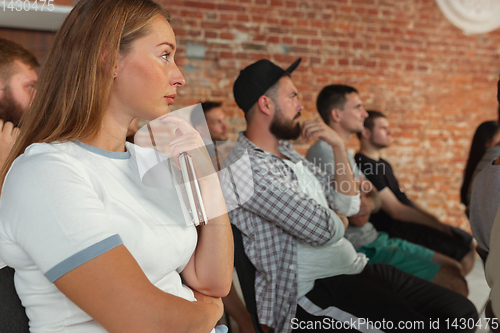 Image of Students listening to presentation in hall at university workshop