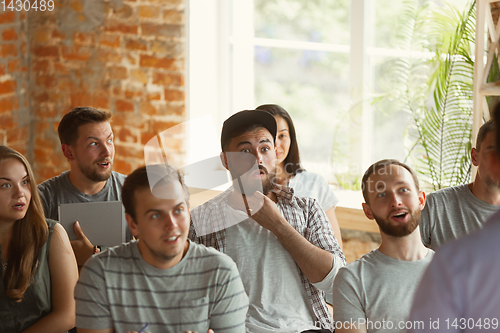 Image of Students listening to presentation in hall at university workshop