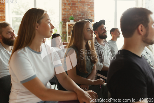 Image of Students listening to presentation in hall at university workshop