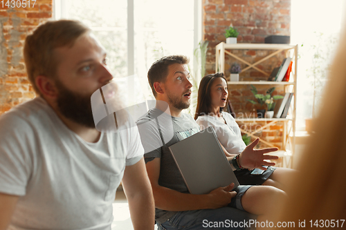 Image of Students listening to presentation in hall at university workshop