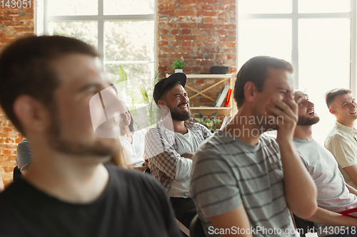 Image of Students listening to presentation in hall at university workshop