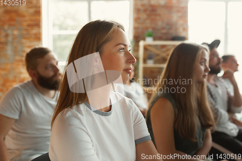 Image of Students listening to presentation in hall at university workshop