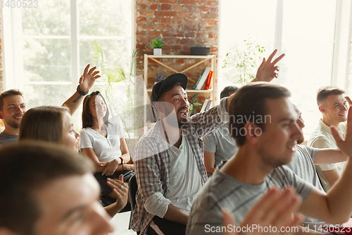 Image of Male speaker giving presentation in hall at university workshop