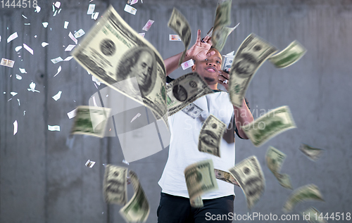 Image of black businessman making the rain of money