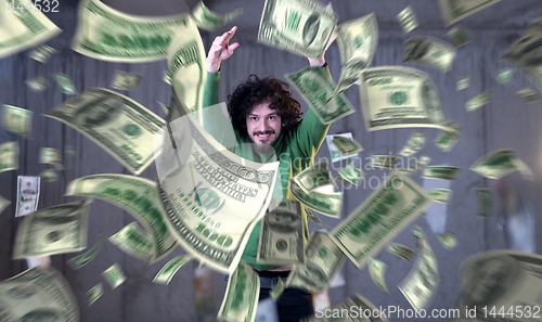 Image of businessman making the rain of money