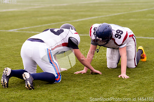 Image of professional american football players training