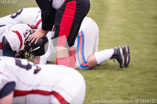 Image of professional american football players training