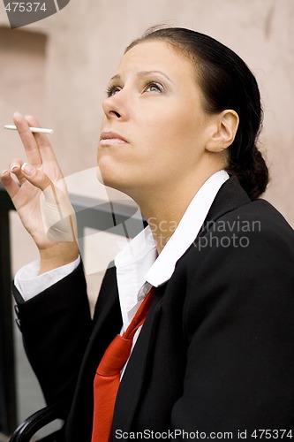 Image of businesswoman with cigarette