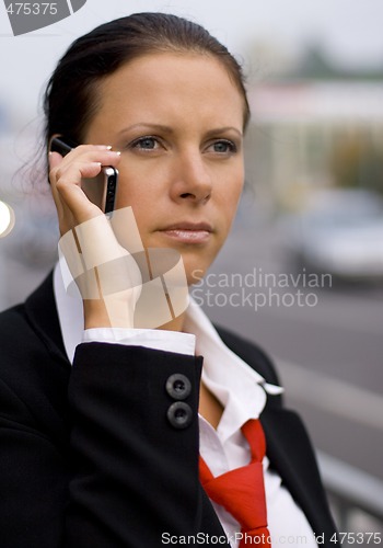 Image of businesswoman talking by mobile phone